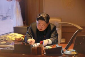 File photo shows North Korean leader Kim Jong Un signing a document in Pyongyang